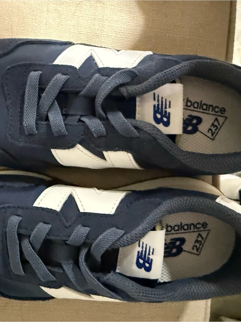 New Balance Kids Navy Blue and White Sneakers
